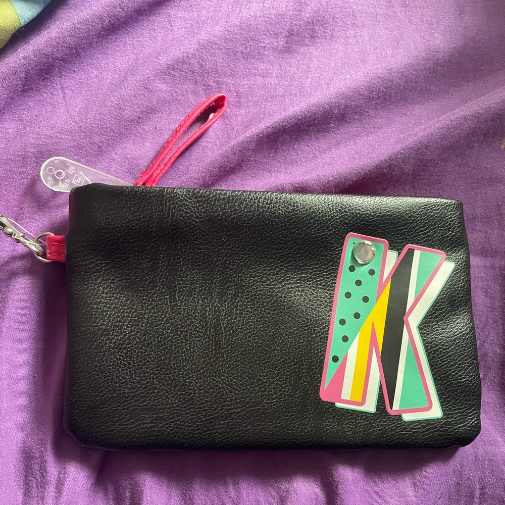 NWT wristlet with zipper and “K” on it